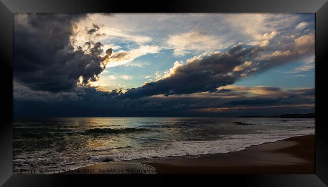 Coast of a sea and dramatic sky. Evening time.  Framed Print by Sergey Fedoskin
