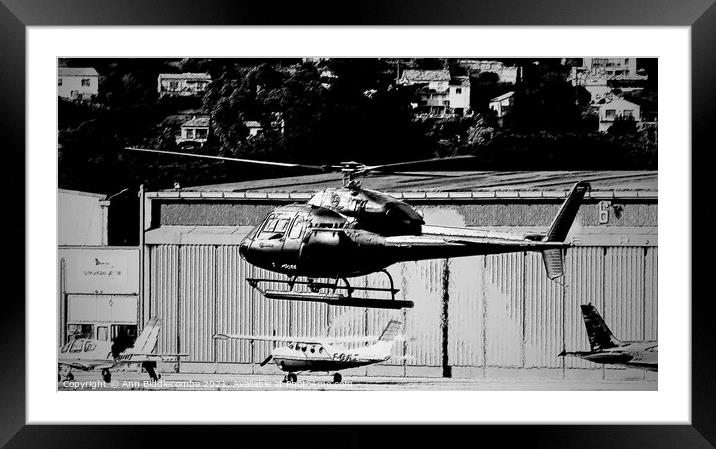 Helicopter hovering in Monochrome Framed Mounted Print by Ann Biddlecombe