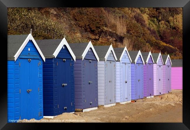 Bournemouth beach huts in harmony. Framed Print by Paul Clifton
