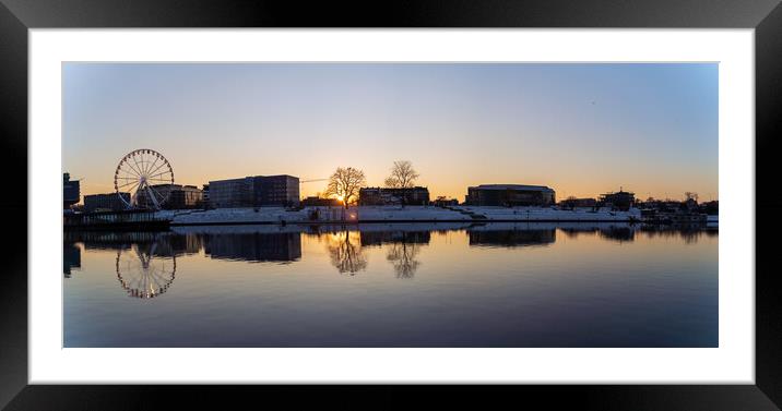 Krakow, Poland - January 31, 2021: Panoramic shot of Cracow cityscape, Ferris wheel and polish architecture next to Vistula river during sunset in Winter. Framed Mounted Print by Arpan Bhatia
