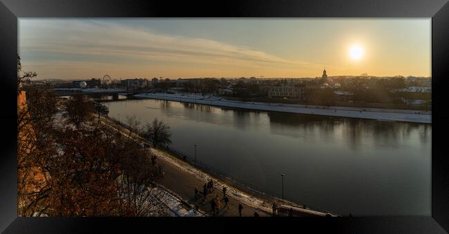 Krakow, Poland - January 31, 2021: Panorama aerial shot of Cracow cityscape next to Vistula river during sunset in Winter with people doing leisure. Framed Print by Arpan Bhatia