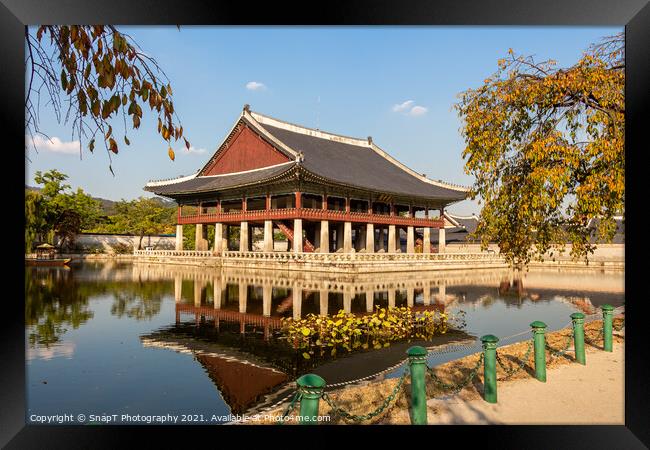 A Korean pavilion reflecting on a lake at Gyeongbokgung Palace on an autumn day Framed Print by SnapT Photography