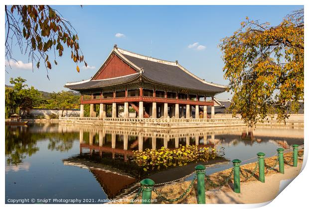 A Korean pavilion reflecting on a lake at Gyeongbokgung Palace on an autumn day Print by SnapT Photography