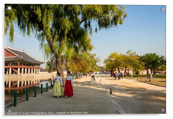 Two women in hanboks walking beside the lake at Gyeongbokgung Palace, Seoul Acrylic by SnapT Photography