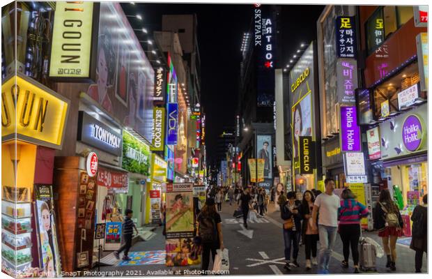 Myeongdong Shopping District at night in Seoul, South Korea Canvas Print by SnapT Photography