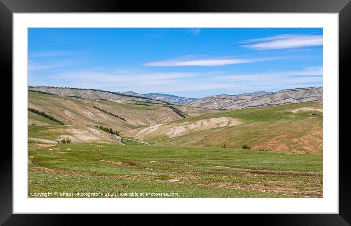 Rolling Mongolian hills and mountains, with a blue cloudy sky Framed Mounted Print by SnapT Photography