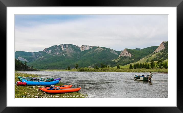 Fishing guide setting up at camp early on the river in the morning Framed Mounted Print by SnapT Photography