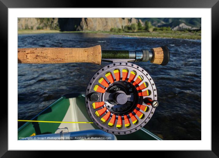 Close up of a fly fishing rod and reel in the late evening sun Framed Mounted Print by SnapT Photography