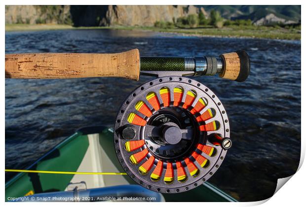 Close up of a fly fishing rod and reel in the late evening sun Print by SnapT Photography