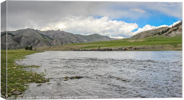 A fast river in Mongolia, with mountains and blue sky Canvas Print by SnapT Photography
