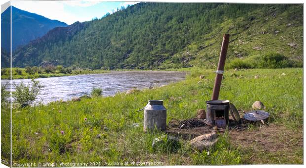 A traditional Mongolian camp cooker and chimney, beside a river Canvas Print by SnapT Photography