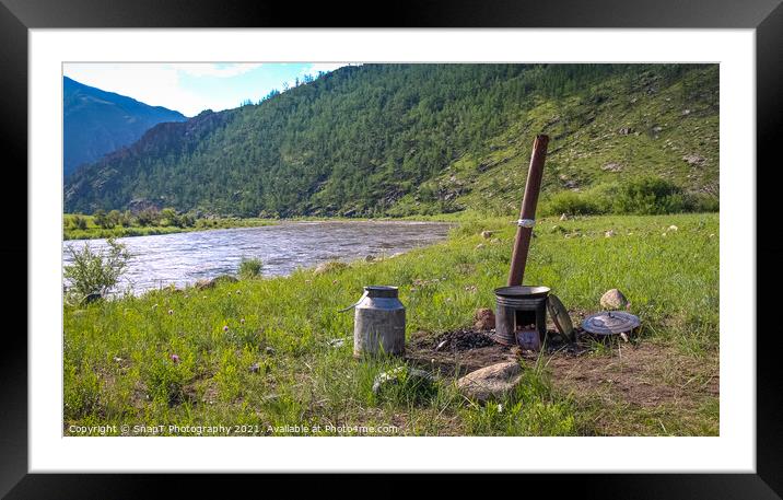 A traditional Mongolian camp cooker and chimney, beside a river Framed Mounted Print by SnapT Photography