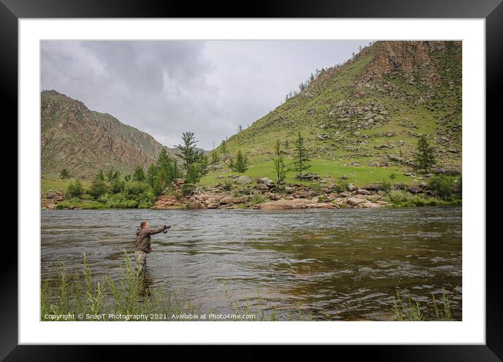 Fly fisherman casting a fly on a river in Mongolia during the summer, Moron, Mongolia Framed Mounted Print by SnapT Photography
