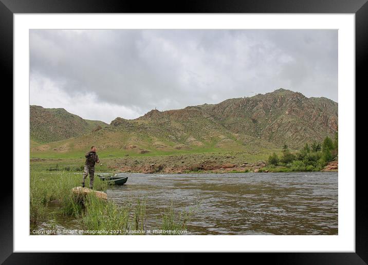 Fly fisherman casting a fly on a river in Mongolia during the summer, Moron, Mongolia Framed Mounted Print by SnapT Photography