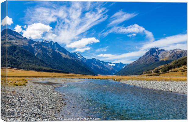 The upper Ahuriri River on a sunny day, surrounded by snow capped mountains Canvas Print by SnapT Photography