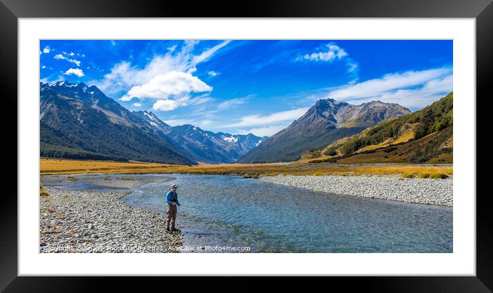An Angler fly fishing for trout on the Ahuriri river, surrounded by mountains Framed Mounted Print by SnapT Photography