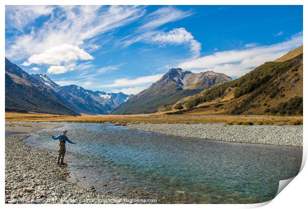 A fly fisherman casting for trout on the Ahuriri River in New Zealand Print by SnapT Photography