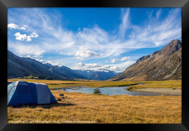 A tent pitched beside a river, surrounded by mountains, in New Zealand Framed Print by SnapT Photography