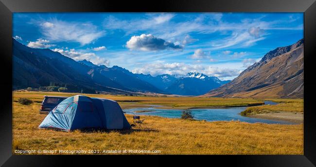 A tent pitched beside a river, surrounded by mountains, in New Zealand Framed Print by SnapT Photography