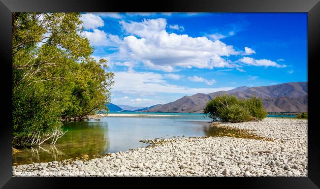 The slow flowing Pukaki river as it flows into Lake Benmore on a sunny day Framed Print by SnapT Photography