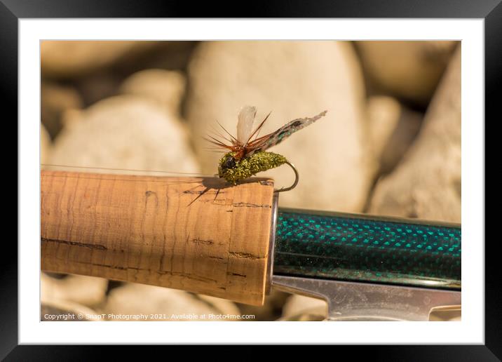 A macro shot of an artificial cicada fly for fishing for trout Framed Mounted Print by SnapT Photography