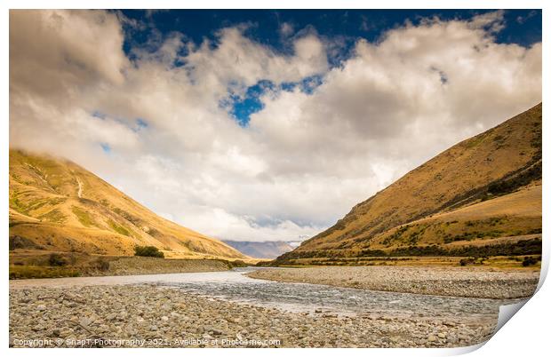 A New Zealand mountain stream in a V shaped valley with dramatic clouds Print by SnapT Photography