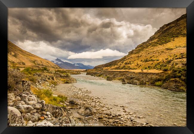 A mountain landscape and river on a cloudy day in New Zealand near Omarama Framed Print by SnapT Photography