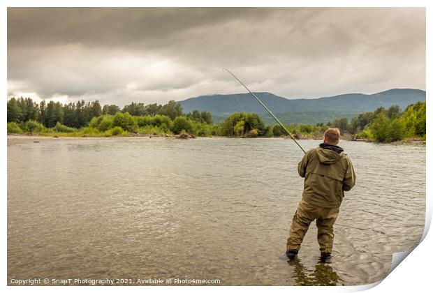 Fisherman battling a fish with a bent rod, while wading. Print by SnapT Photography