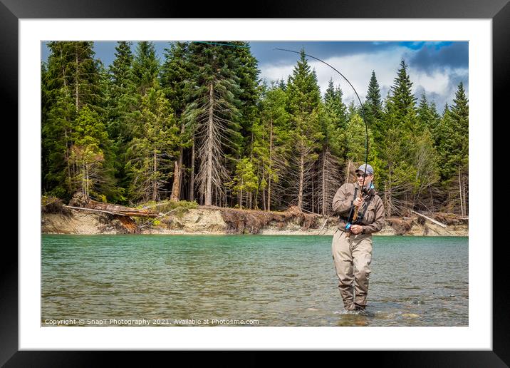 Closeup of a sport fly fisherman hooked into a salmon on a river in British Columbia Framed Mounted Print by SnapT Photography