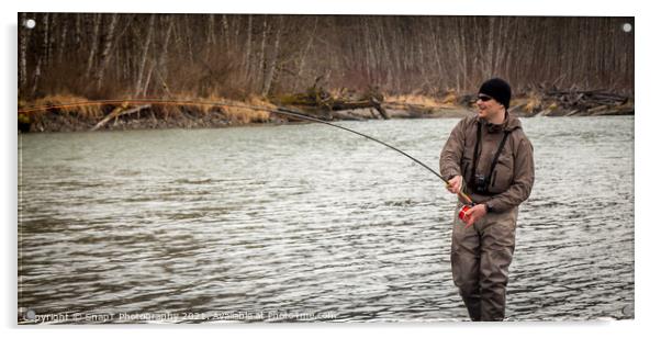 A fly fisherman hooked into a big fish in a river with the rod bent Acrylic by SnapT Photography