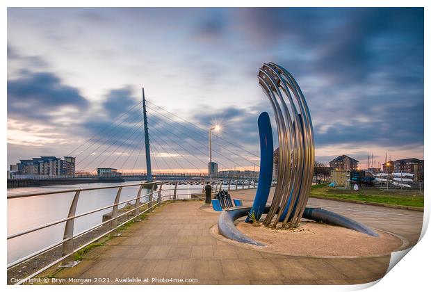 Sail bridge at Swansea marina with sculpture in foreground Print by Bryn Morgan