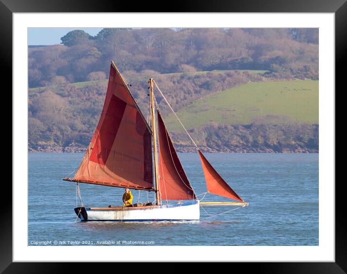 sailboat with red sails Framed Mounted Print by Nik Taylor