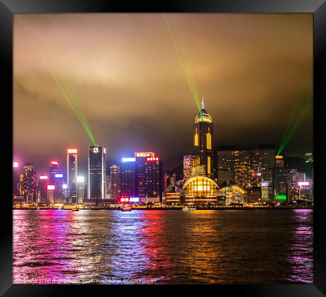 Laser Light Show Over Victoria Harbour At Tsim Sha Tsui, Hong Ko Framed Print by Peter Greenway