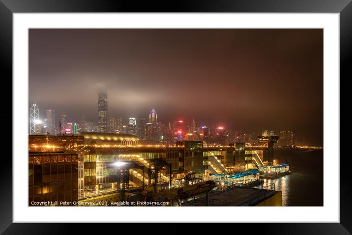China Ferry Terminal, Hong Kong Illuminated At Night Framed Mounted Print by Peter Greenway