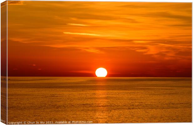 Sunset on the sea with orange clouds Canvas Print by Chun Ju Wu