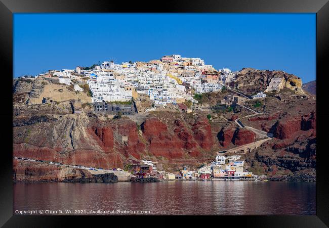 View of the white buildings of Oia village from Aegean Sea, Santorini, Greece Framed Print by Chun Ju Wu