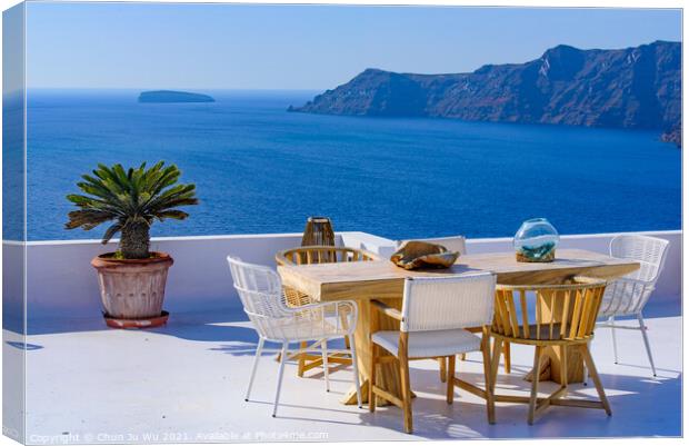 Outdoor seats facing Aegean Sea in Oia, Santorini, Greece Canvas Print by Chun Ju Wu