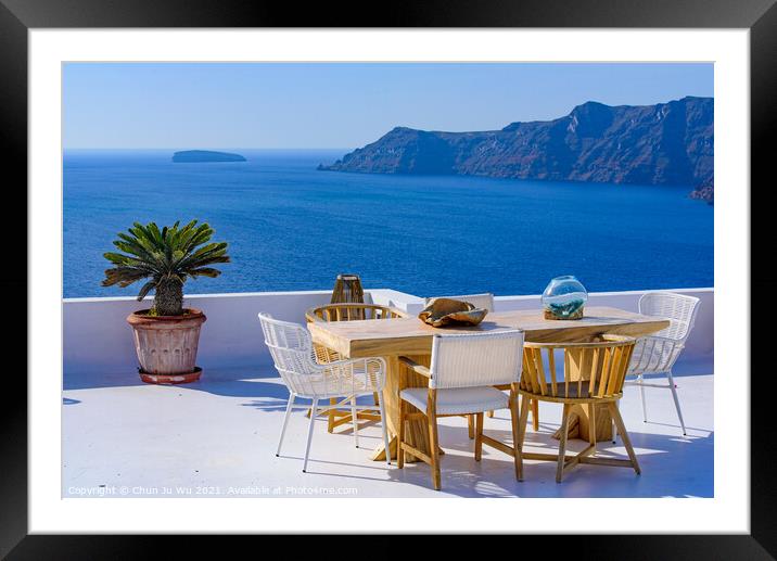 Outdoor seats facing Aegean Sea in Oia, Santorini, Greece Framed Mounted Print by Chun Ju Wu