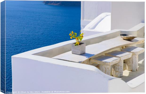 Outdoor seats facing Aegean Sea in Oia, Santorini, Greece Canvas Print by Chun Ju Wu