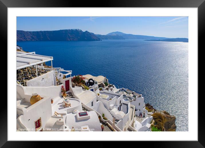 Traditional white buildings facing Aegean Sea in Oia, Santorini island, Greece Framed Mounted Print by Chun Ju Wu