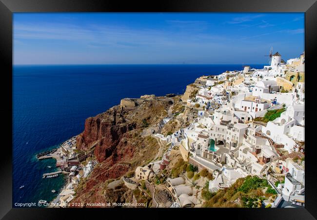 Traditional white buildings facing Aegean Sea in Oia, Santorini island, Greece Framed Print by Chun Ju Wu