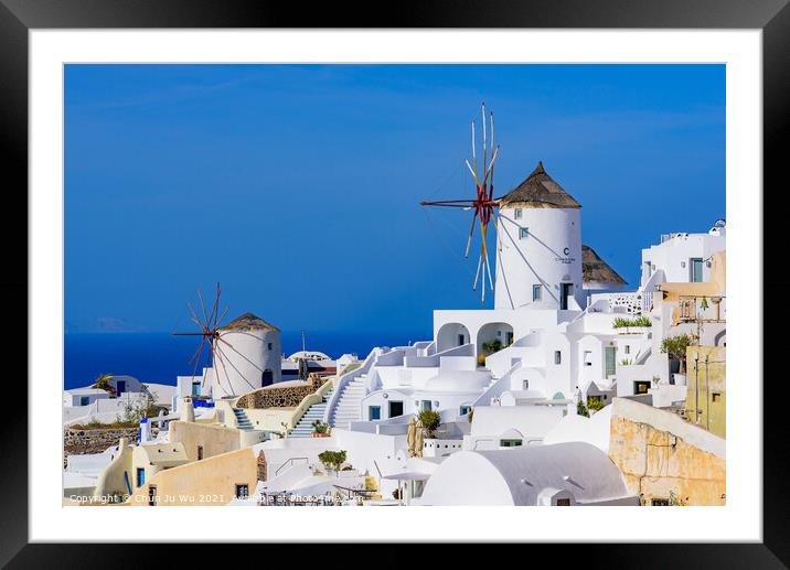 Windmill and traditional white buildings facing Aegean Sea in Oia, Santorini, Greece Framed Mounted Print by Chun Ju Wu