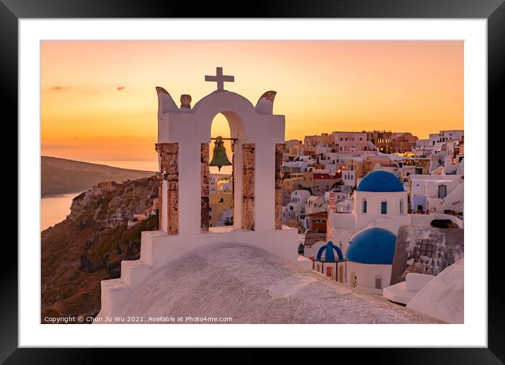 Blue domed churches and bell tower facing Aegean Sea with warm sunset light in Oia, Santorini, Greece Framed Mounted Print by Chun Ju Wu