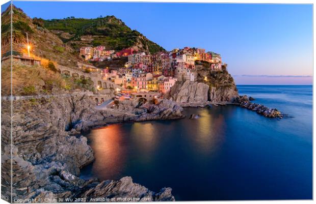 Sunset and night view of Manarola, one of the five Mediterranean villages in Cinque Terre, Italy, famous for its colorful houses and harbor Canvas Print by Chun Ju Wu