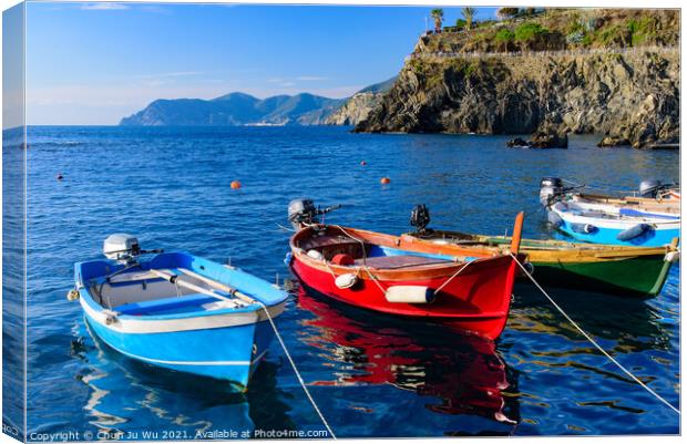 Fishing boats at Manarola, one of the five Mediterranean villages in Cinque Terre, Italy, famous for its colorful houses and harbor Canvas Print by Chun Ju Wu
