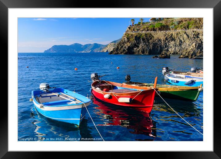 Fishing boats at Manarola, one of the five Mediterranean villages in Cinque Terre, Italy, famous for its colorful houses and harbor Framed Mounted Print by Chun Ju Wu