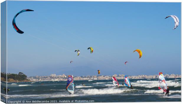  kite surfers and windsurfers  Canvas Print by Ann Biddlecombe