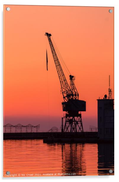 Port crane at sunset Acrylic by Nic Croad