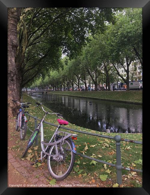 Bicycle in downtown Dusseldorf Framed Print by Graham Lathbury