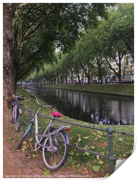Bicycle in downtown Dusseldorf Print by Graham Lathbury